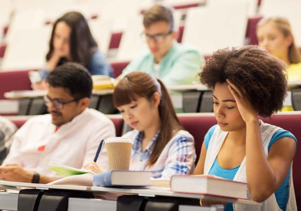 stockfresh_7725410_group-of-students-with-coffee-writing-on-lecture_resized